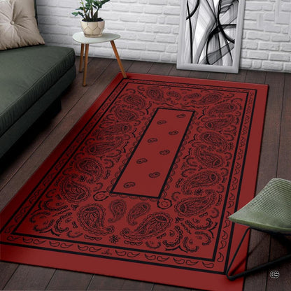 Close-up of crimson area rug artwork highlighting fine black line illustrations and floral paisley details. - thumbnail image 3 of 9