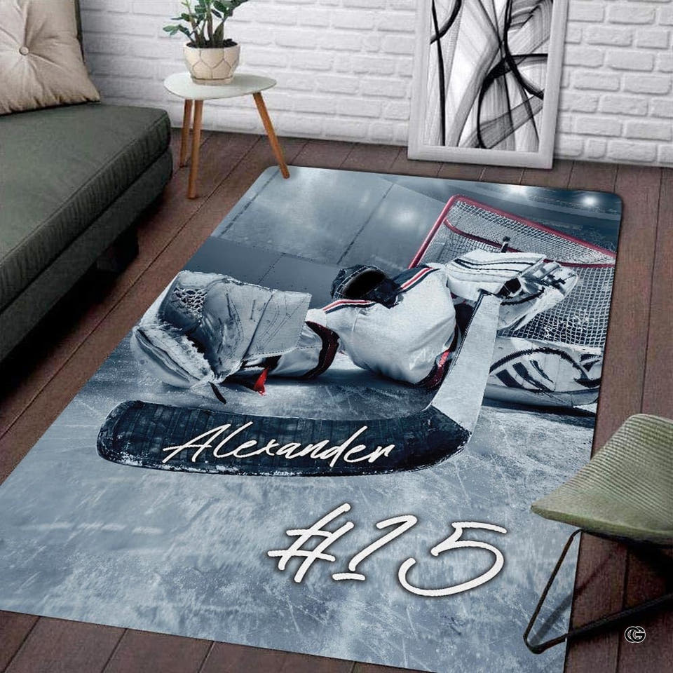 Ice hockey goaltender equipment and red net frame artwork on area rug.