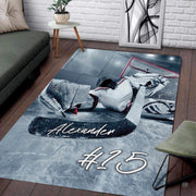 Ice hockey goaltender equipment and red net frame artwork on area rug. - thumbnail image 1 of 7