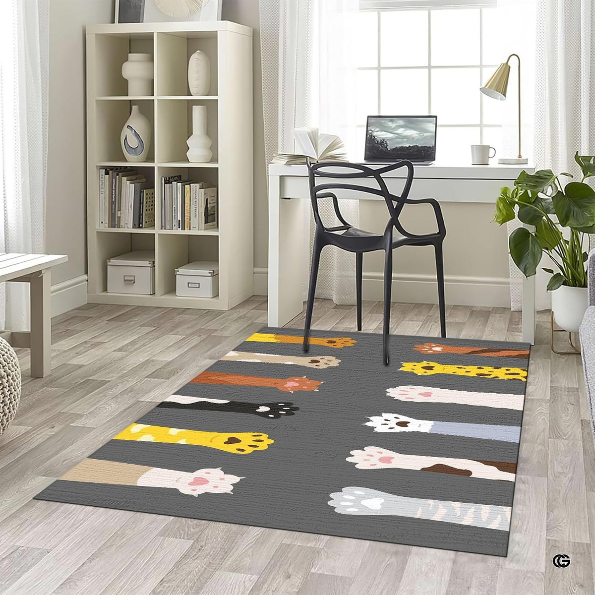Angled perspective showing decorative feline paw motifs on a dark charcoal area rug.
