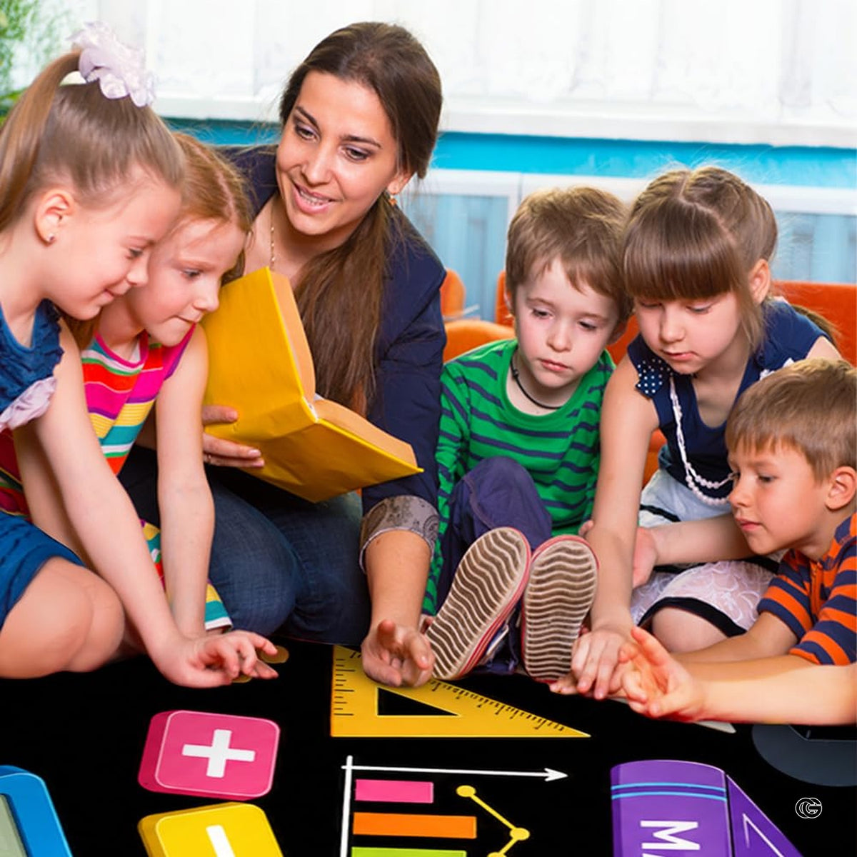 Lifestyle scene featuring teacher and students around math educational rug. - image 5 of 7