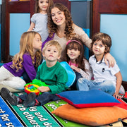 Floor styling view of kids school carpet surrounded by cheerful room decor and organized activity spaces. - thumbnail image 5 of 7