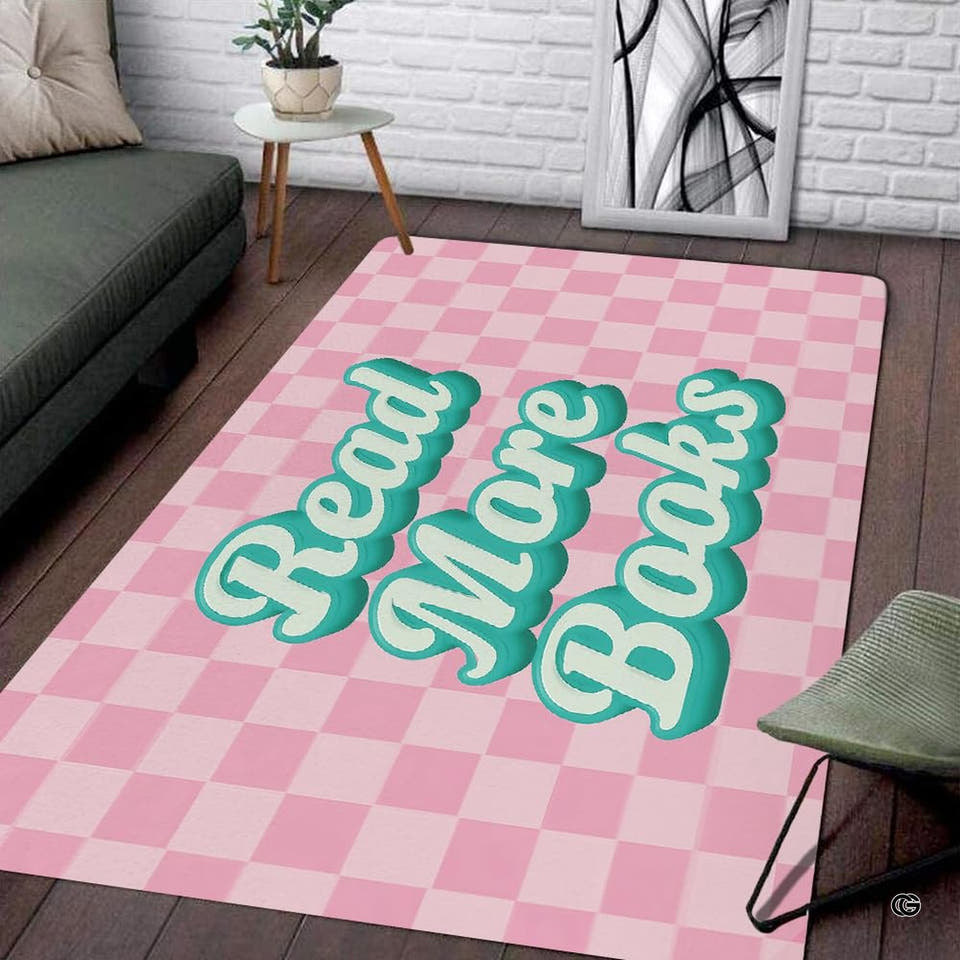 Pink and white checkered area rug with retro 3D script displayed on dark wood flooring