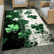 Close shot of shamrock area rug highlighting weathered textures, mint leaves, and white silhouette foliage. - thumbnail image 7 of 8