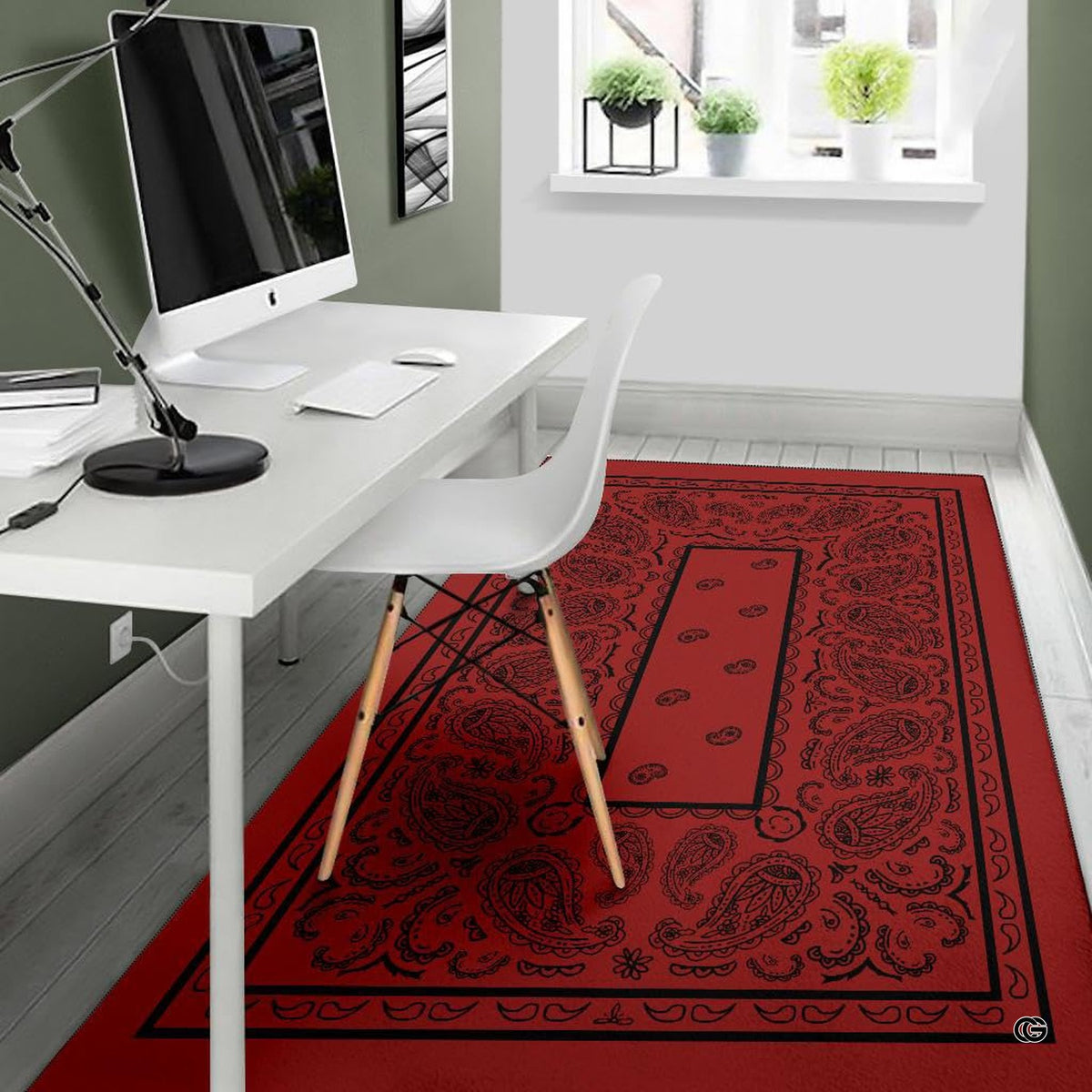 Detailed angle of ornamental rectangular border printing on a deep red western paisley area rug.