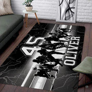 Overhead view of hockey rink rug with bold athletic jersey numbering and crisp monochrome typography. - thumbnail image 2 of 7
