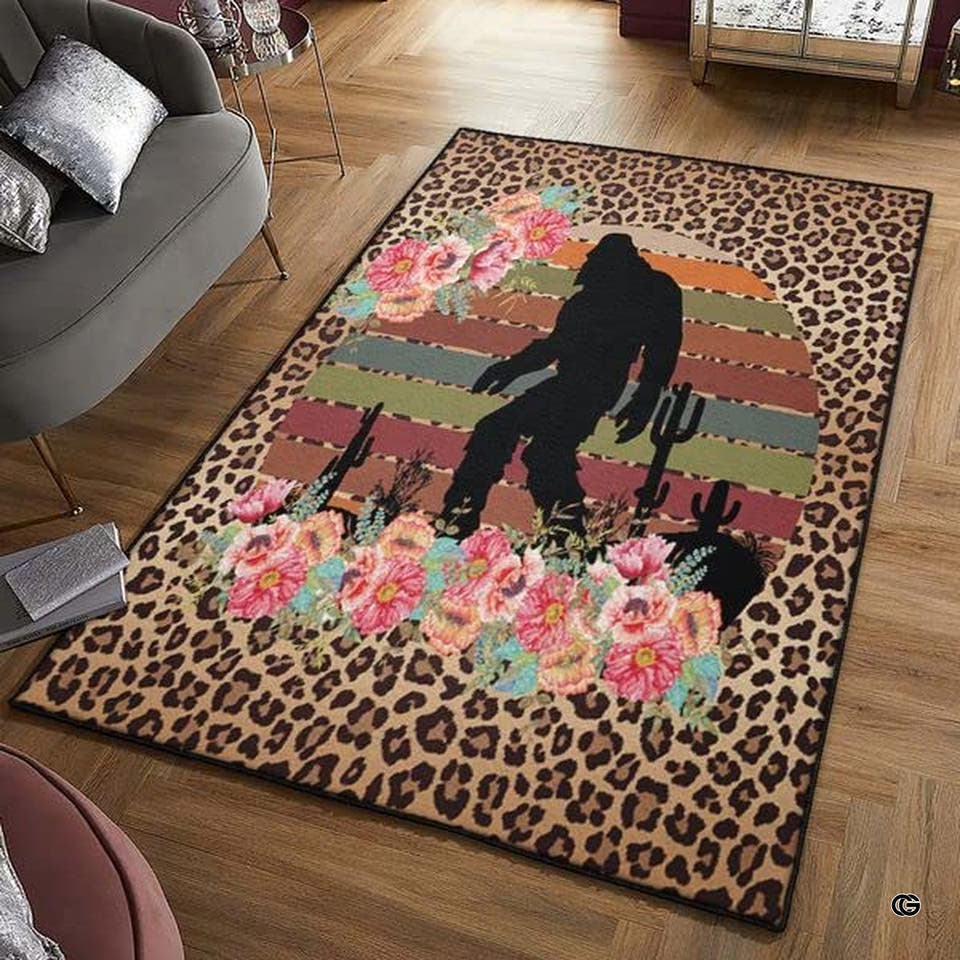 Bigfoot desert sunset leopard print area rug displayed flat showing Sasquatch silhouette and floral accents