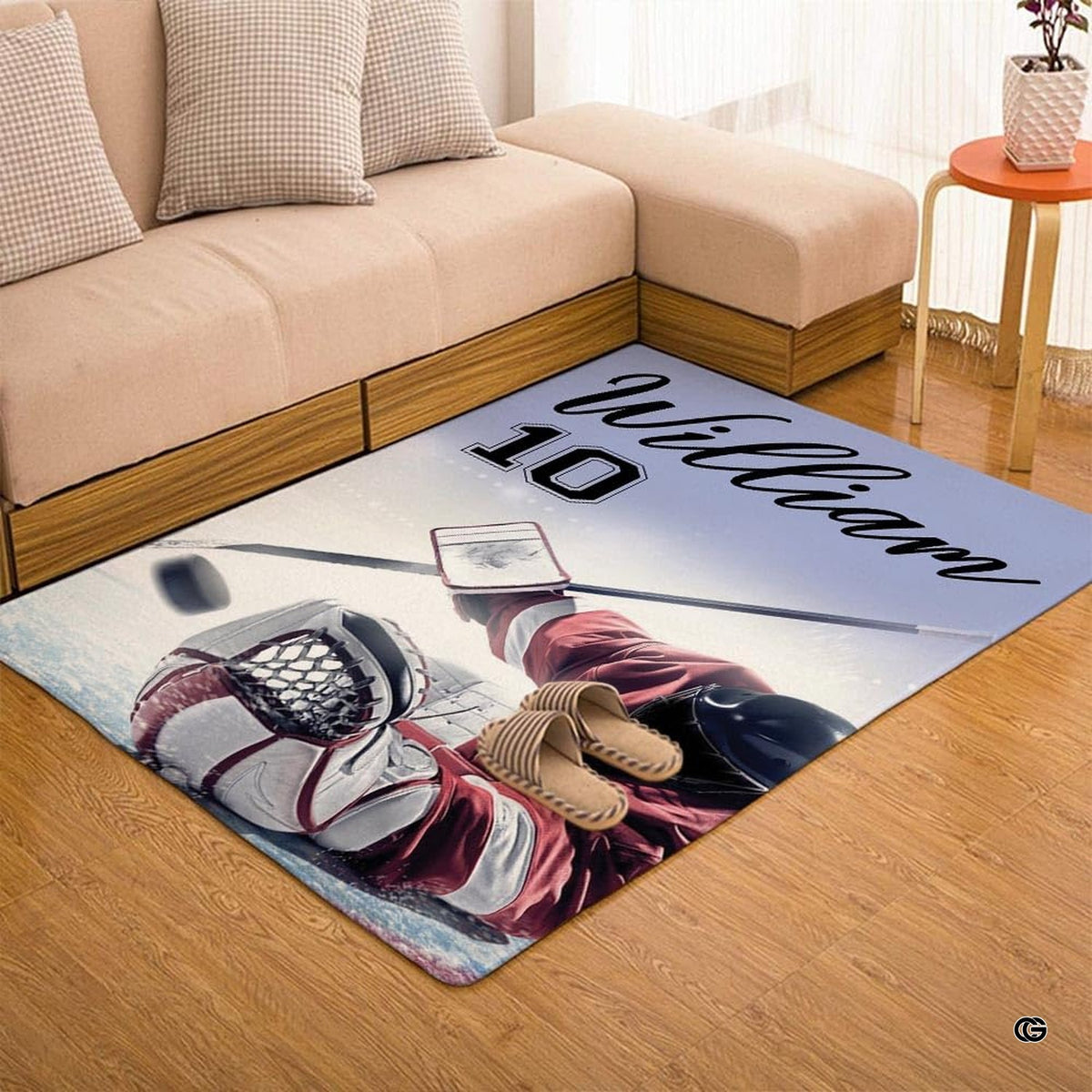 Living space styled with an ice rink rug matching modern athletic wall art and slate gray accents.