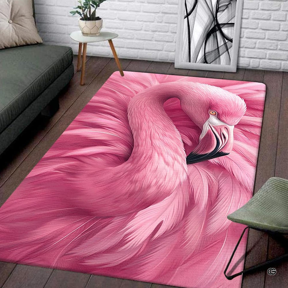 Living room setting featuring a rectangular pink flamingo feather plumage area rug on wood flooring.