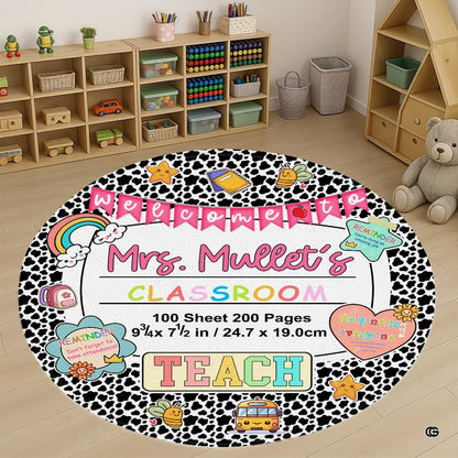 Cow print classroom decor area rug featuring a circular lined notebook center and colorful school illustrations. - thumbnail image 1 of 7