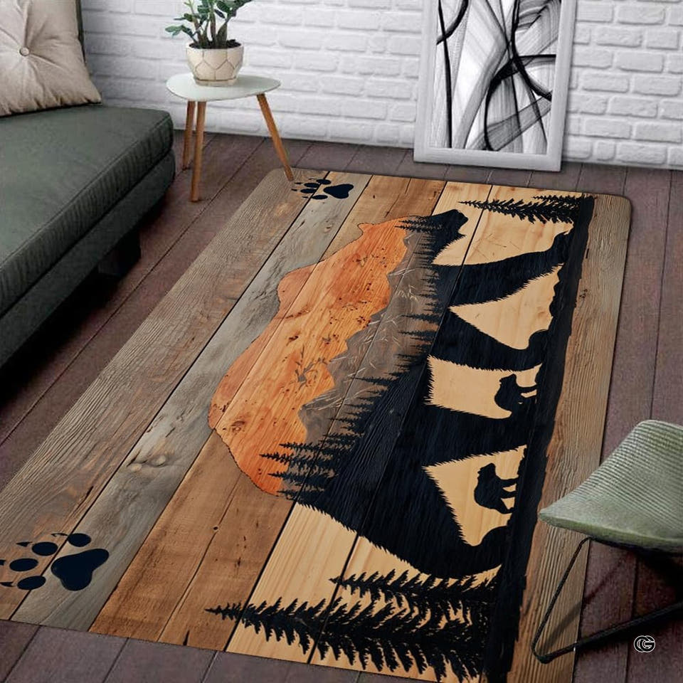 Rustic area rug showing a bear silhouette with mountain forest art on wood planks.