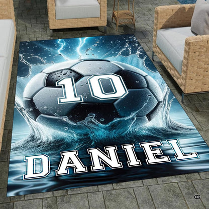 Soccer ball bursting through water splashes and cyan lightning bolts on an athletic graphic area rug. - thumbnail image 1 of 8