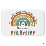 Boho rainbow arch with sign language hand alphabet illustrations on a classroom area rug