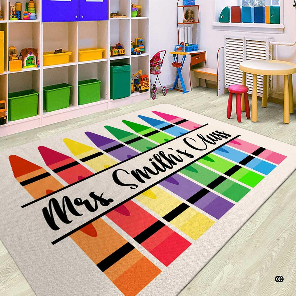 Playroom view displaying a rectangular rainbow crayons educational area rug on wood laminate flooring.