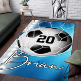 Modern living room floor setting featuring a sky blue soccer goal net athletic sports area rug