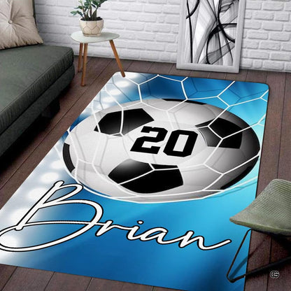 Modern living room floor setting featuring a sky blue soccer goal net athletic sports area rug - thumbnail image 1 of 7