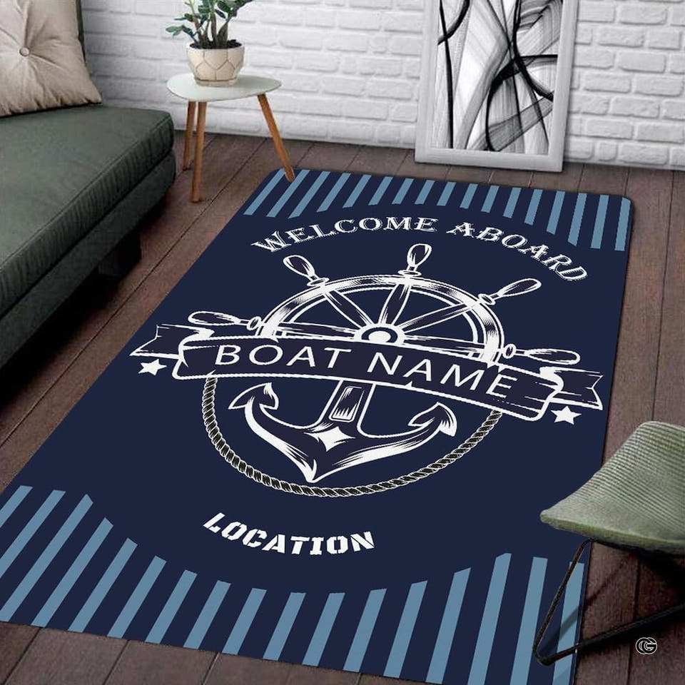 Nautical anchor design coastal rug living room centerpiece with steering wheel graphic on navy background.