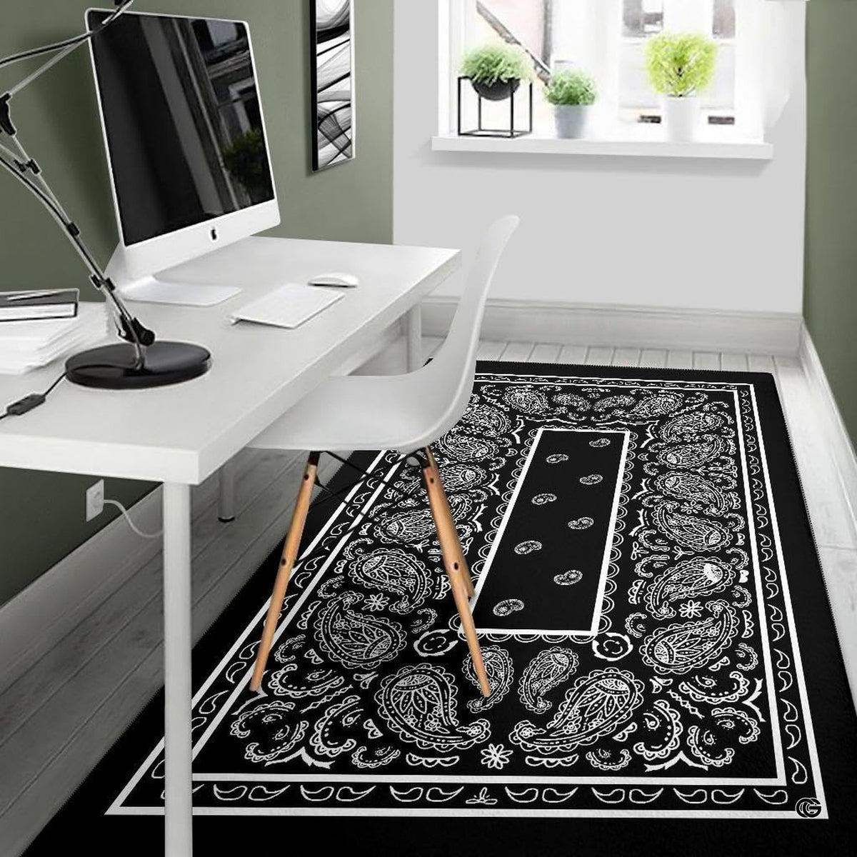 Styling presentation of the black and white bandana print rug beneath living room furniture.