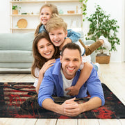 Lifestyle scene featuring family lounging on american flag stag area rug. - thumbnail image 5 of 7