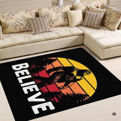 Close-up of distressed graphic print details on a Bigfoot silhouette and pine forest sunset area rug. - thumbnail image 4 of 5