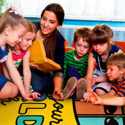 Crayon box classroom door area rug accenting a bright reading corner surrounded by picture books. - thumbnail image 6 of 7