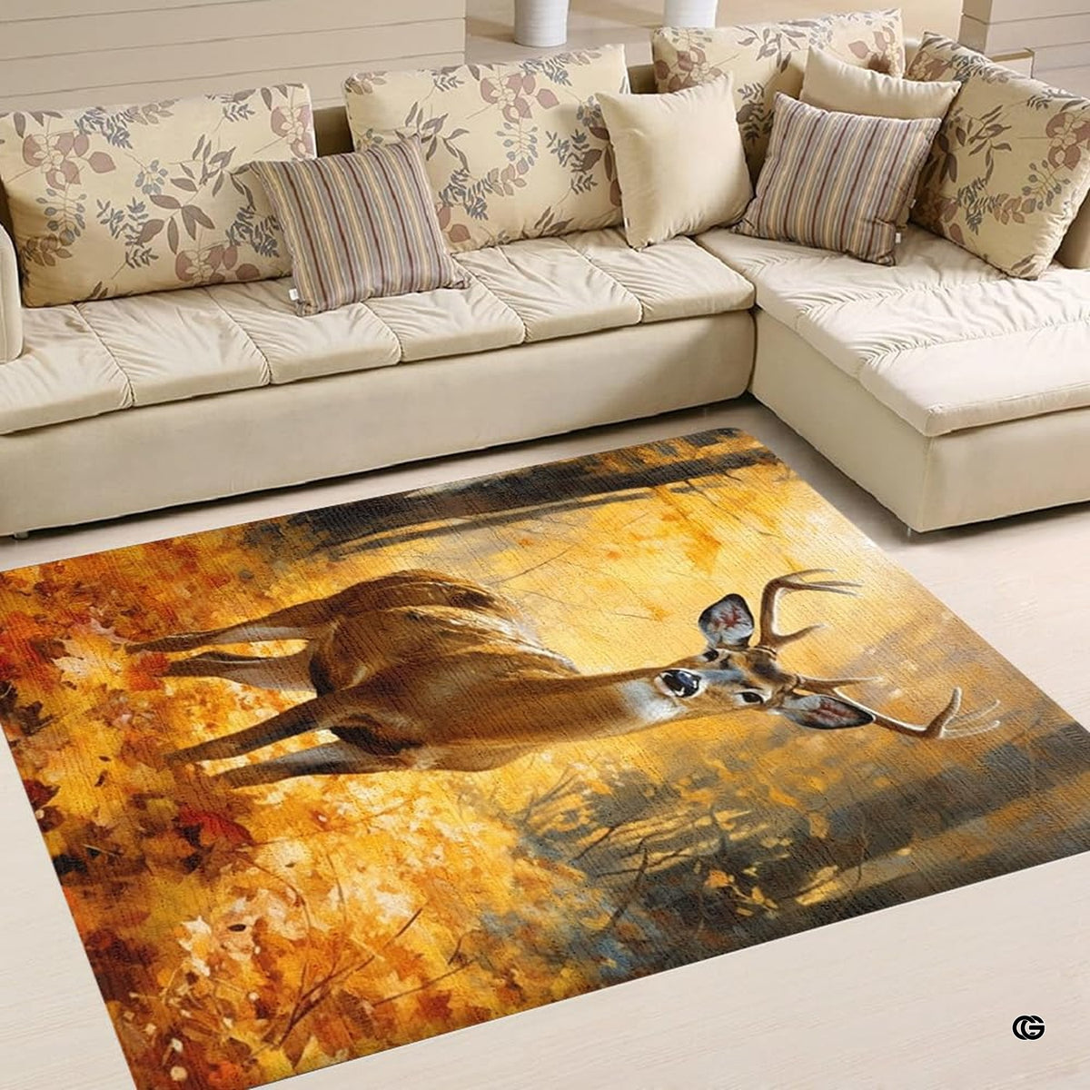 Overhead view of an artistic deer and forest pattern area rug showing rich amber, ochre, and brown hues.
