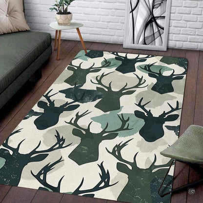 Green pattern area rug showcasing antlered buck silhouettes and watercolor camouflage patches in a living room. - thumbnail image 1 of 7