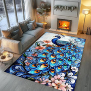 Overhead perspective of ornate peacock artwork displayed across a decorative botanical area rug. - thumbnail image 5 of 8