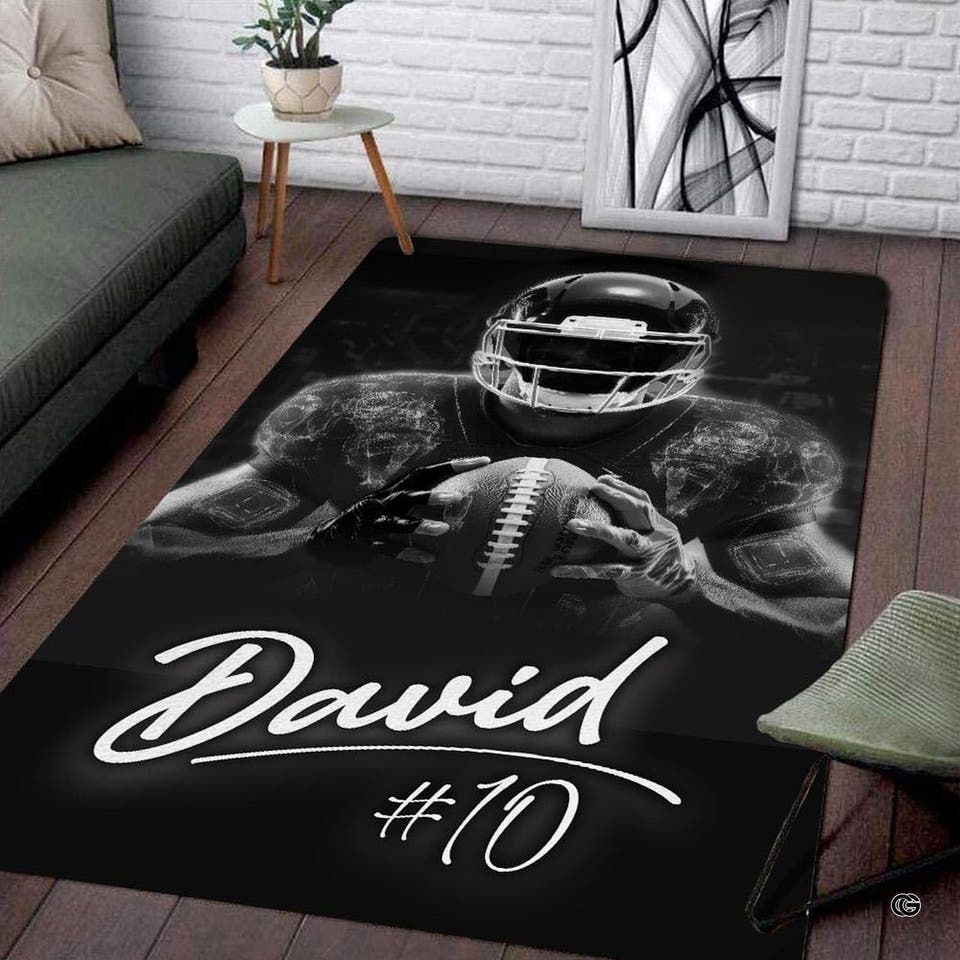 Monochrome football player rug showing athlete in helmet holding ball thematic accent dark stadium.
