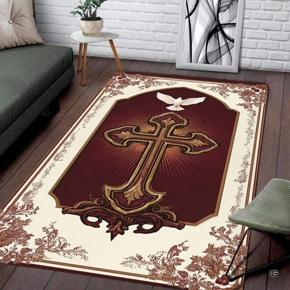 Ornate cross area rug displaying baroque golden cross and white dove on dark floor beside gray couch.
