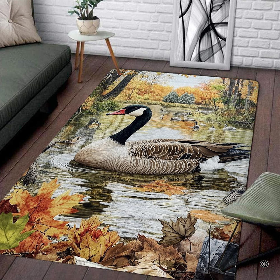 Wildlife themed area rugs featuring Canada geese swimming on an autumn lake with orange foliage.