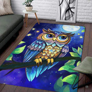 Angled perspective of nocturnal owl area rug arranged beneath modern living room furniture. - thumbnail image 3 of 8