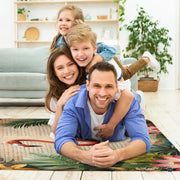 Living room arrangement showing vintage botanical script flamingo rug on wooden floor - thumbnail image 5 of 7