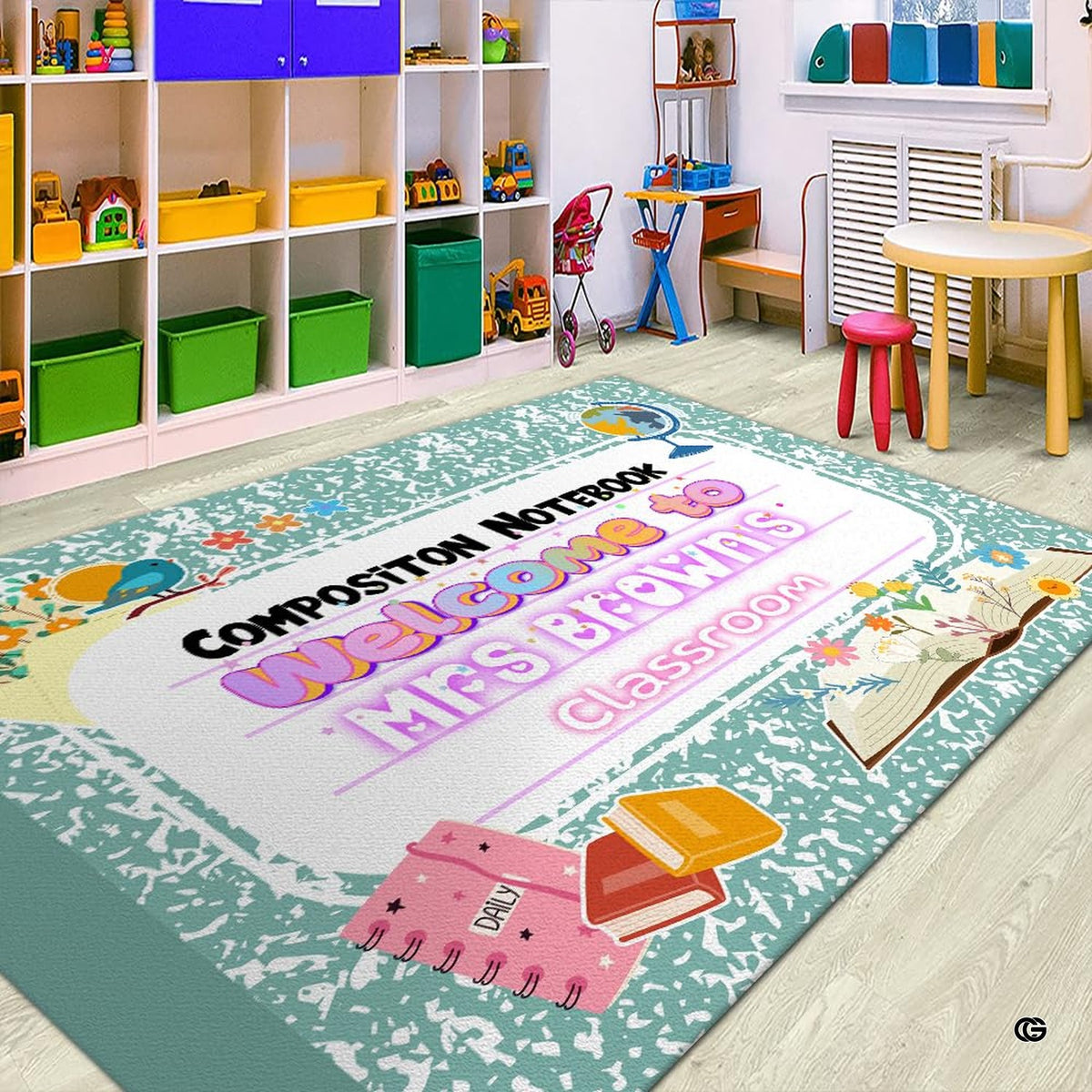 Green marbled composition notebook classroom area rug with welcome teacher banner and floral school motifs. (Angle 2)