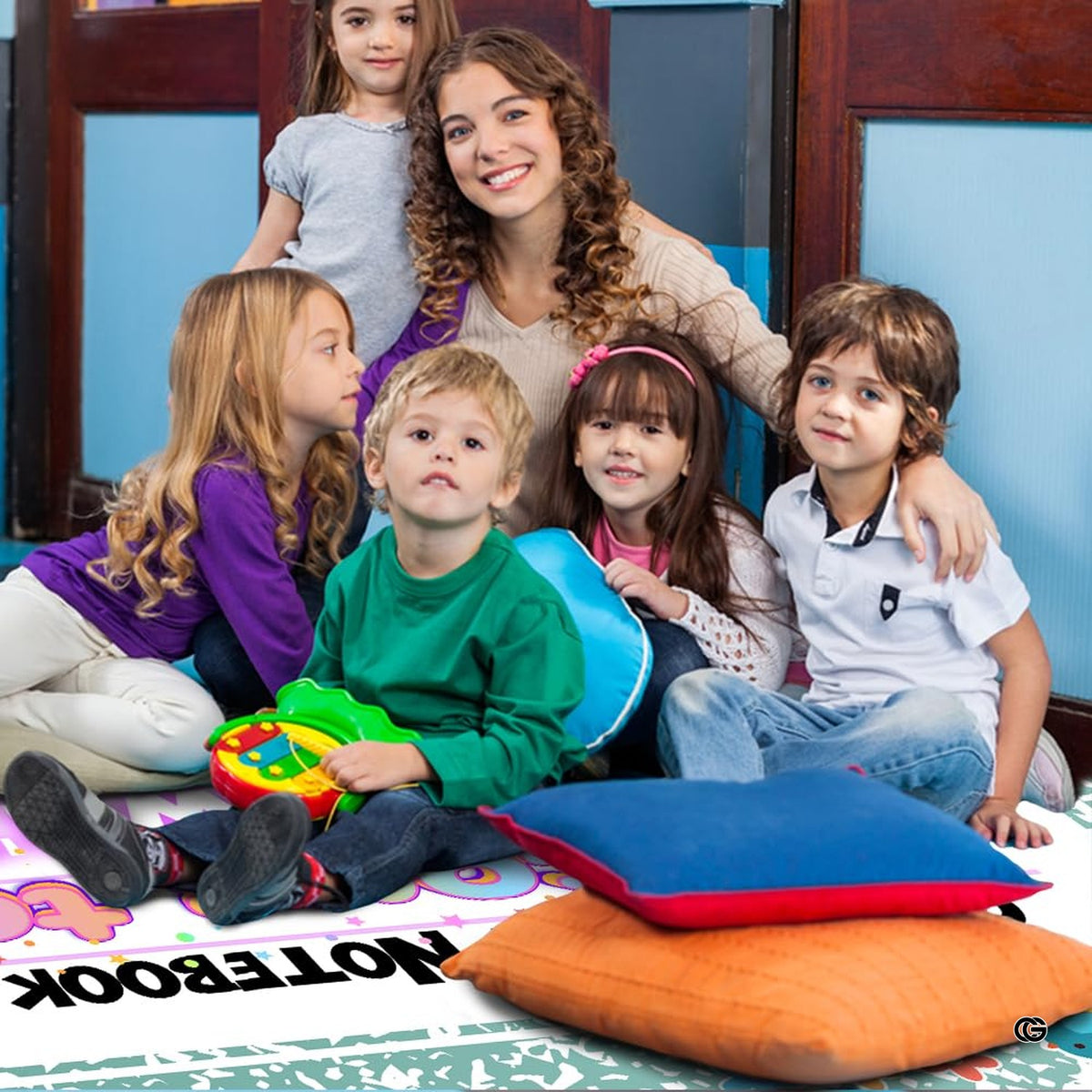 Green marbled composition notebook classroom area rug with welcome teacher banner and floral school motifs. (Angle 7)