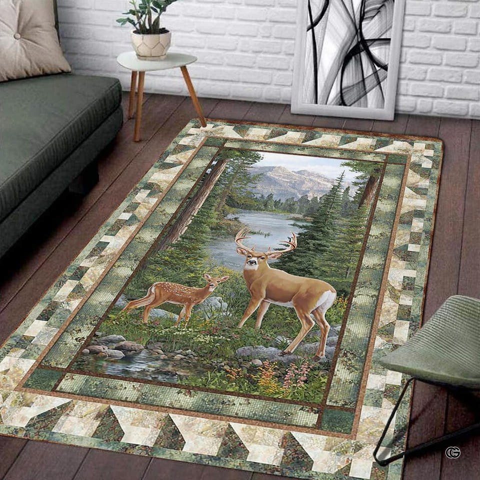 Living room corner with gray sofa and side table displaying the rectangular mountain deer area rug on wood floors.