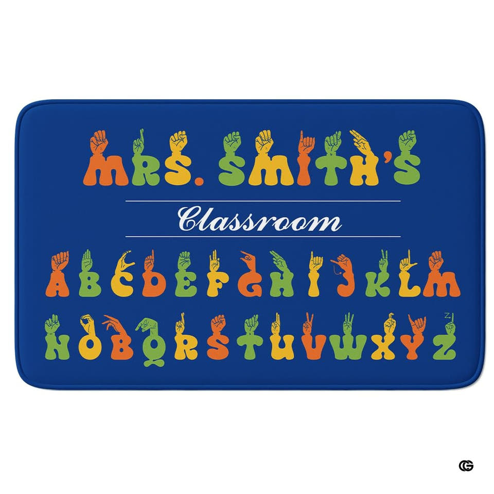 ASL alphabet classroom sign language chart rectangular area rug on blue background.