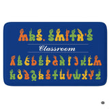 ASL alphabet classroom sign language chart rectangular area rug on blue background.