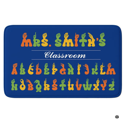 ASL alphabet classroom sign language chart rectangular area rug on blue background.