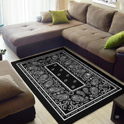 Overhead view showing the intricate teardrop swirls and floral motif on this monochrome rug. - thumbnail image 2 of 9