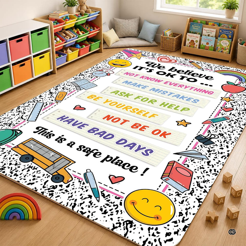Classroom play corner with storage bins and bookshelves showing the school bus growth mindset floor rug.