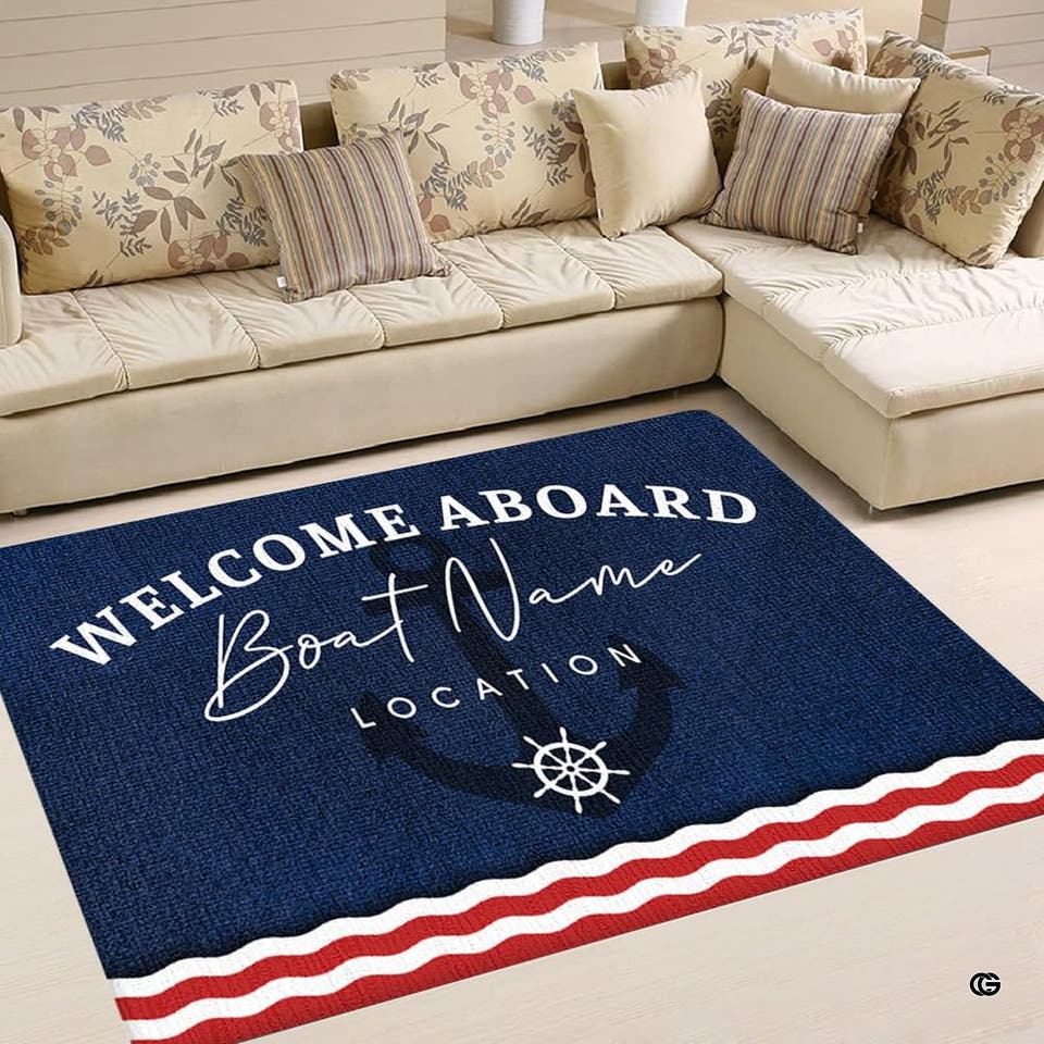 Overhead living room scene with sectional couch and pillows displaying the navy maritime rug with red and white wavy stripes.