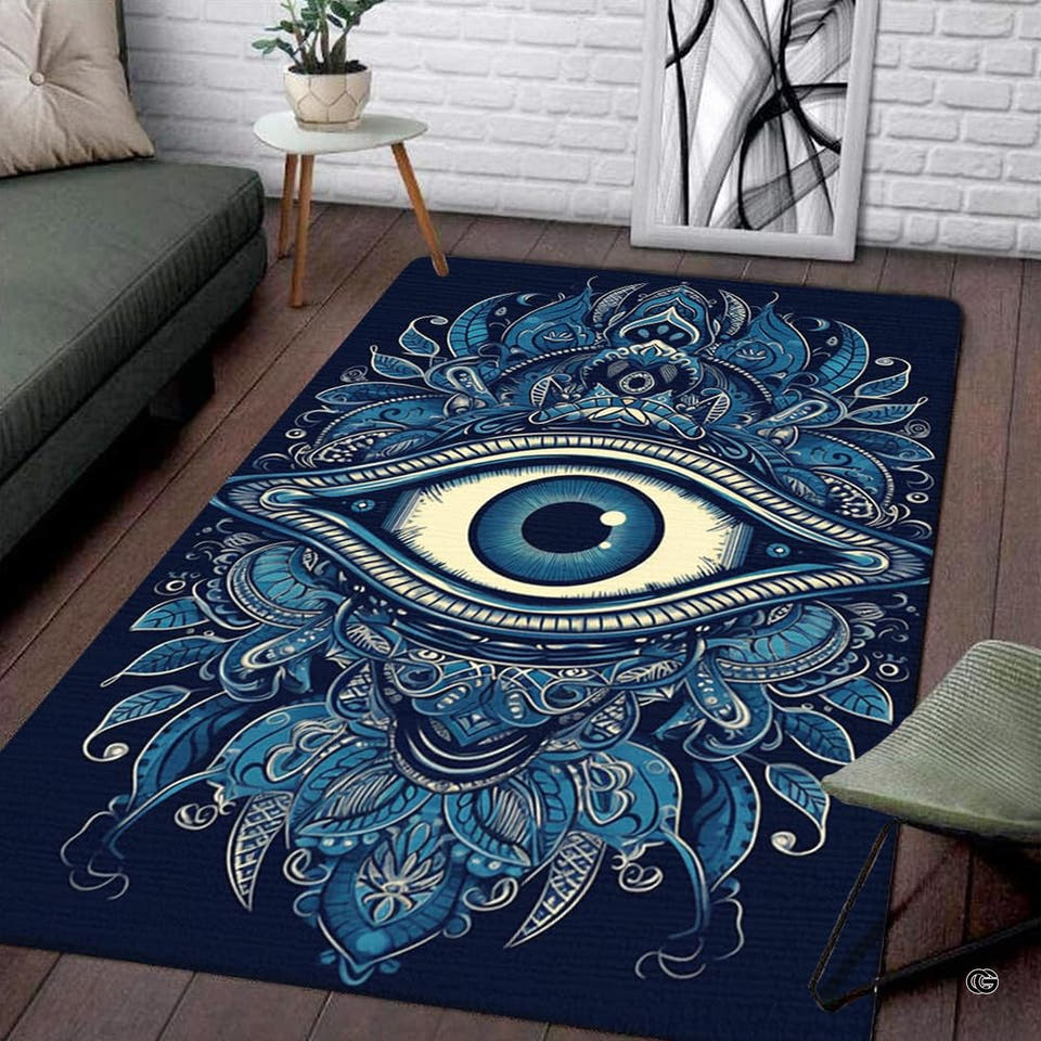 Mystical blue evil eye mandala rectangular area rug displayed on wood flooring in a modern living room setting.