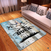 Rustic wood area rug with waterfowl motif arranged under coffee table furniture in a lodge living room. - thumbnail image 4 of 6