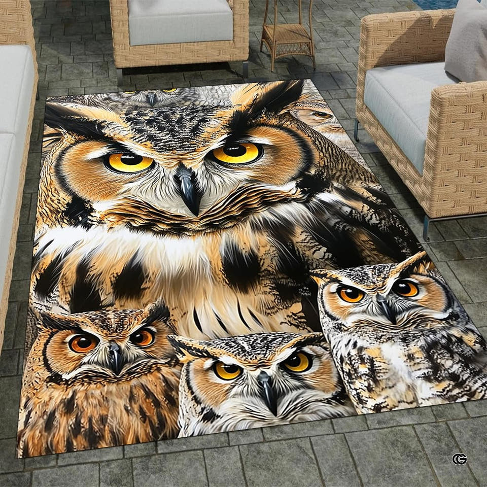Full overhead view of a bold graphic area rug featuring a horned owl family with amber eyes and ochre plumage.
