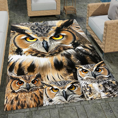 Full overhead view of a bold graphic area rug featuring a horned owl family with amber eyes and ochre plumage. - thumbnail image 1 of 8