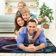 Rainbow puzzle octopus area rug styled in modern patio seating setup - thumbnail image 5 of 7