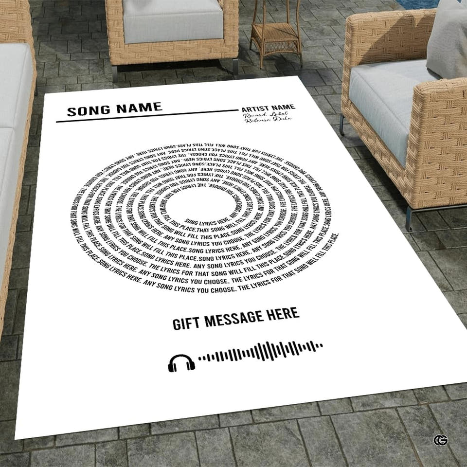 White rectangular area rug displaying concentric spiral audio track pattern shown in patio setting.