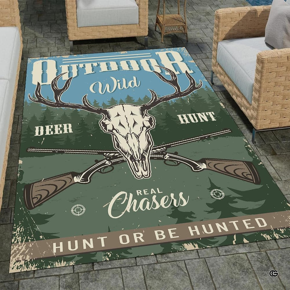 Rustic hunting lodge area rug displaying decorative accent skull, crossed rifles, and forest trees in a cabin room.