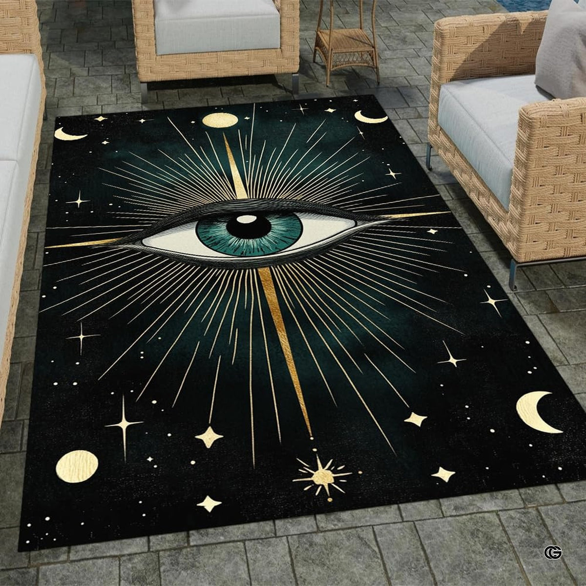 Outdoor patio stone lounge setting displaying the dark celestial evil eye area rug